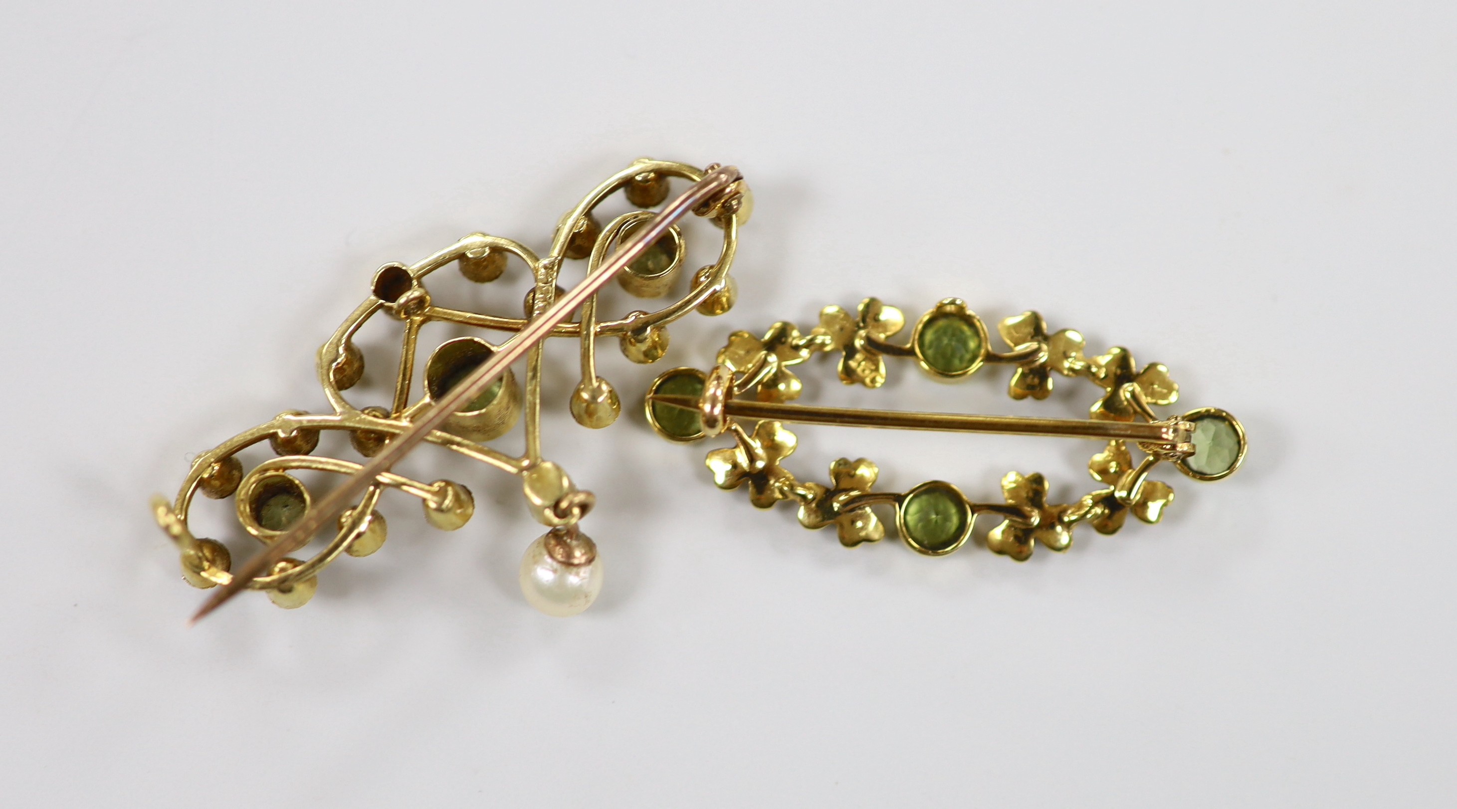 Two late Victorian 15ct, peridot and seed pearl set brooches, one with drop pearl, 41mm, gross weight 9.2 grams.
